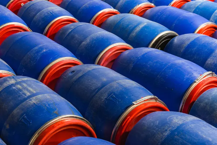 closeup-shot-blue-barrels-factory_181624-4653